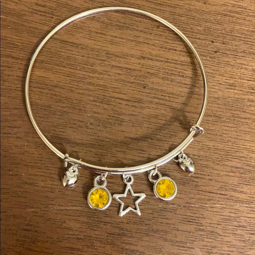 A beautiful metal bracelet with a star and hearts